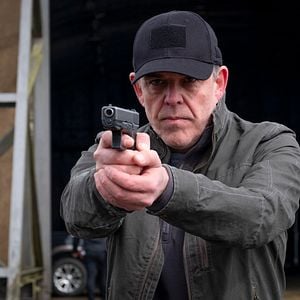 Foto Agente bajo fuego